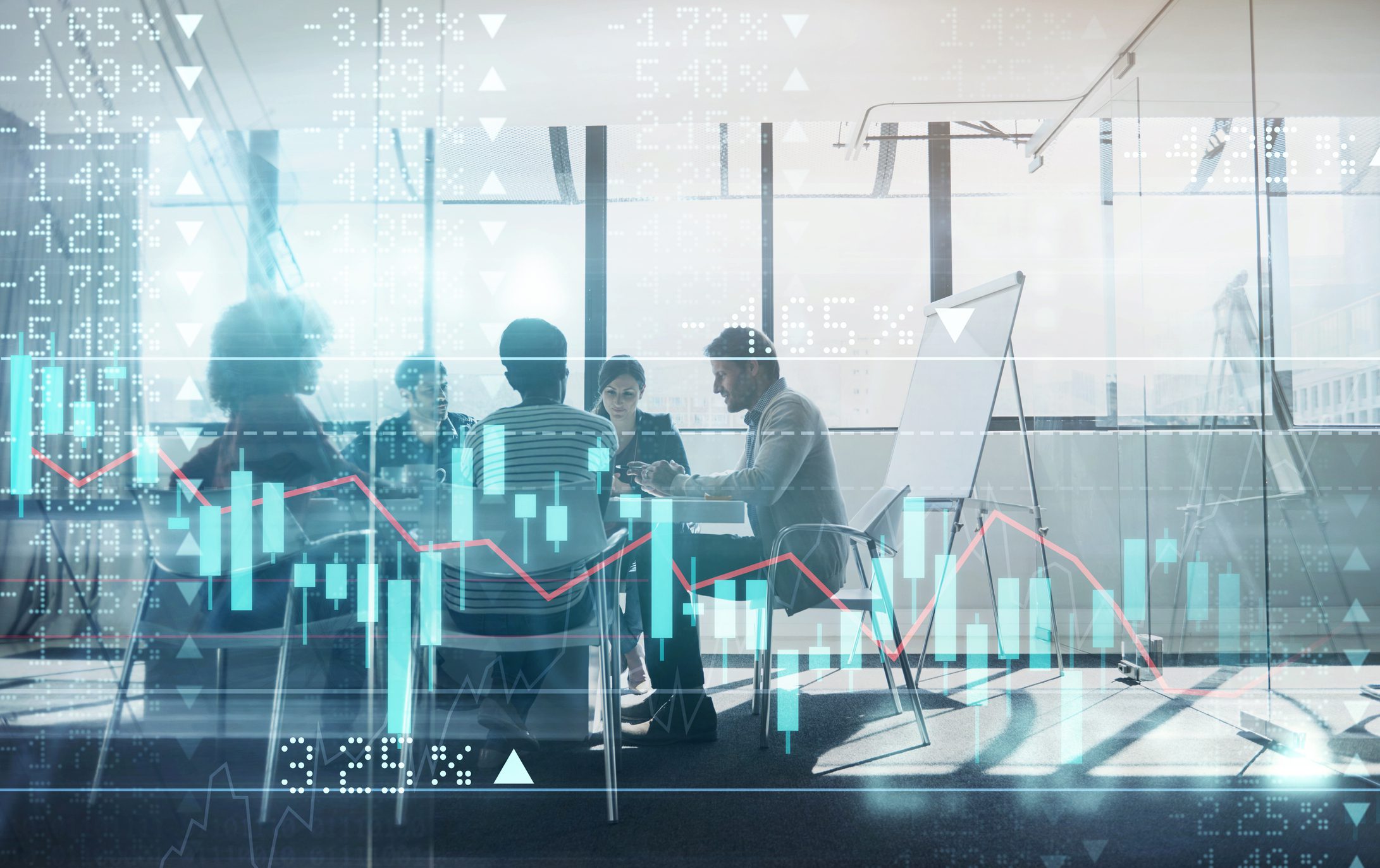 Business meeting with financial charts overlay.