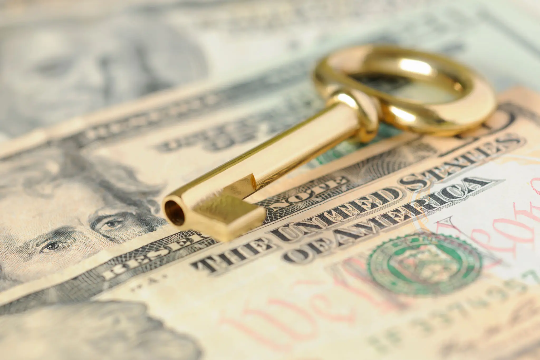 Golden key on U.S. dollar bills.